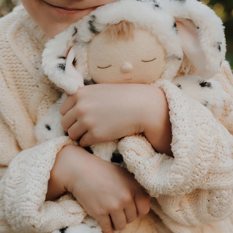 Child cuddling Dalmatian Dog plush soft toy