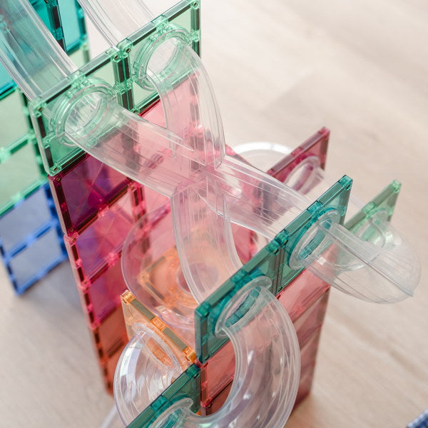 Connetix Tiles | 80 Piece Pastel Ball Run Expansion Pack with X tubes and swirly tubes at Milk Tooth