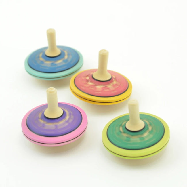 Mader | Burlesque Spinning Top in action mid-spin
