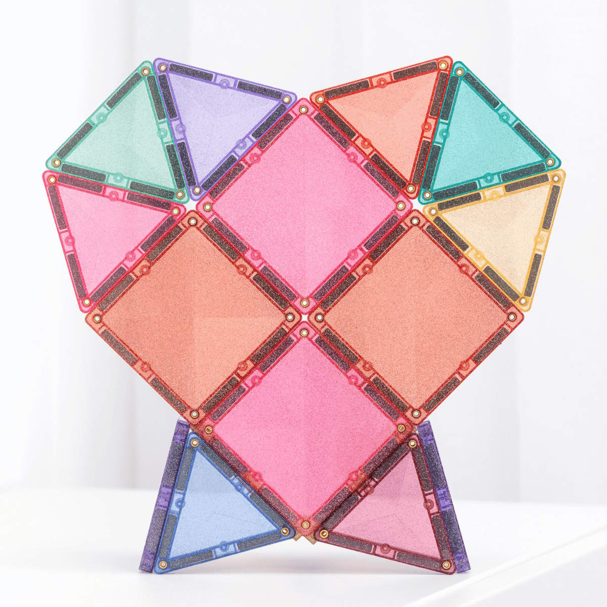 Colorful Connetix geometric magnetic tile set arranged in a heart shape on a white background