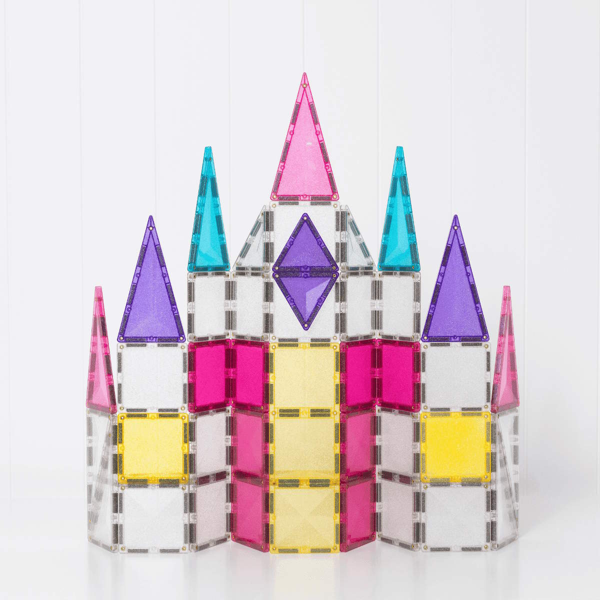 Colorful castle model made of Connetix magnetic tiles on a white background