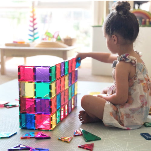 Connetix magnetic building tiles at Milk Tooth wall