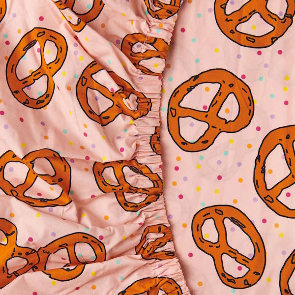 Kip and Co | Pretzels Pink Fitted Cot/Bassinet Sheet at Milk Tooth