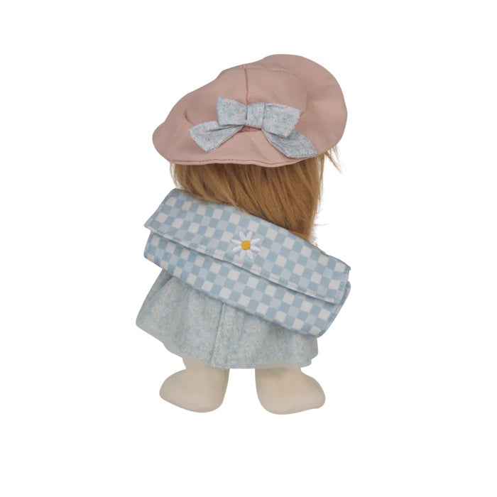 Stuffed toy with a pink hat and checkered outfit on a white background