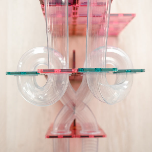 Connetix Tiles | 80 Piece Pastel Ball Run Expansion Pack with spiral tubes and x-shape tubes at Milk Tooth