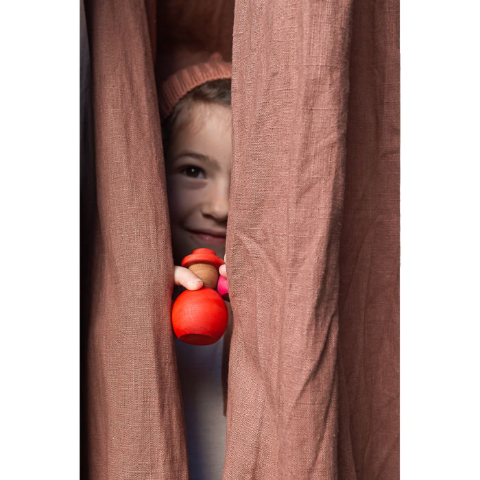Little girl hiding with red peg person from Grapat Together set