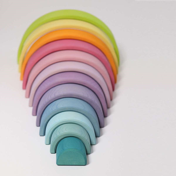 Wooden rainbow toy in soft pastel colours