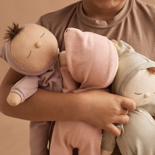 Olli Ella | Dozy Dinkum Doll | Pip in arms of child