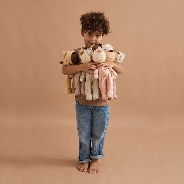 Olli Ella | Dozy Dinkum Dolls having cuddles with a child