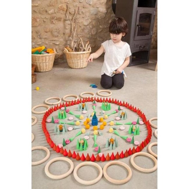Boy playing with Grapat Mandala Wooden Toy Sets